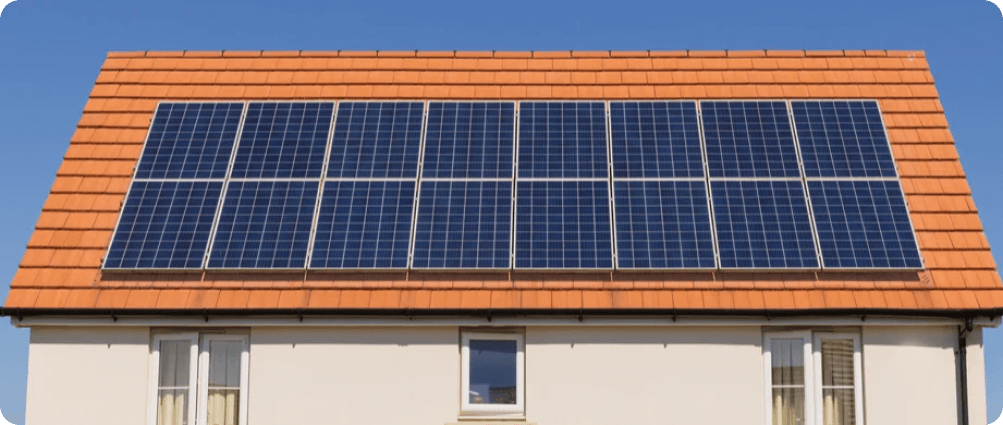 House with solar panels on the orange roof